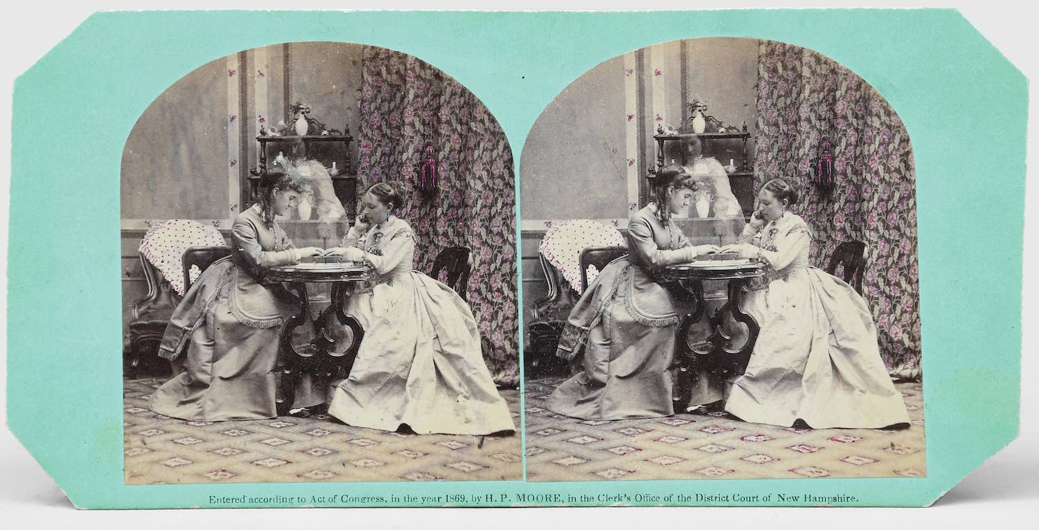 Two stereographs, one depicting the successful use of a Ouija board. Concord, New Hampshire: H. P. Moore, 1869