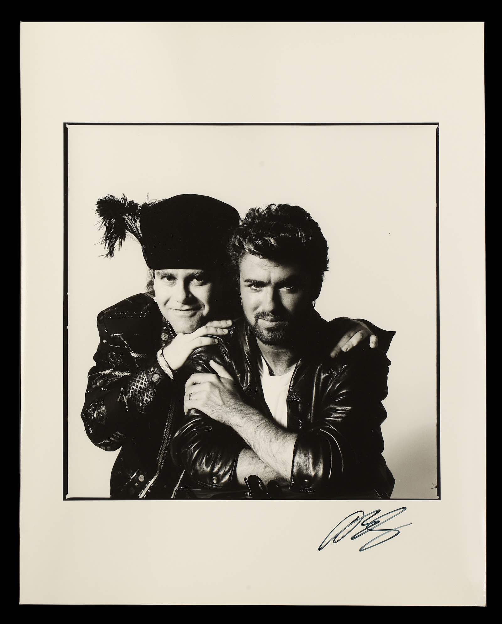 George Michel and Elton John (signed by both)